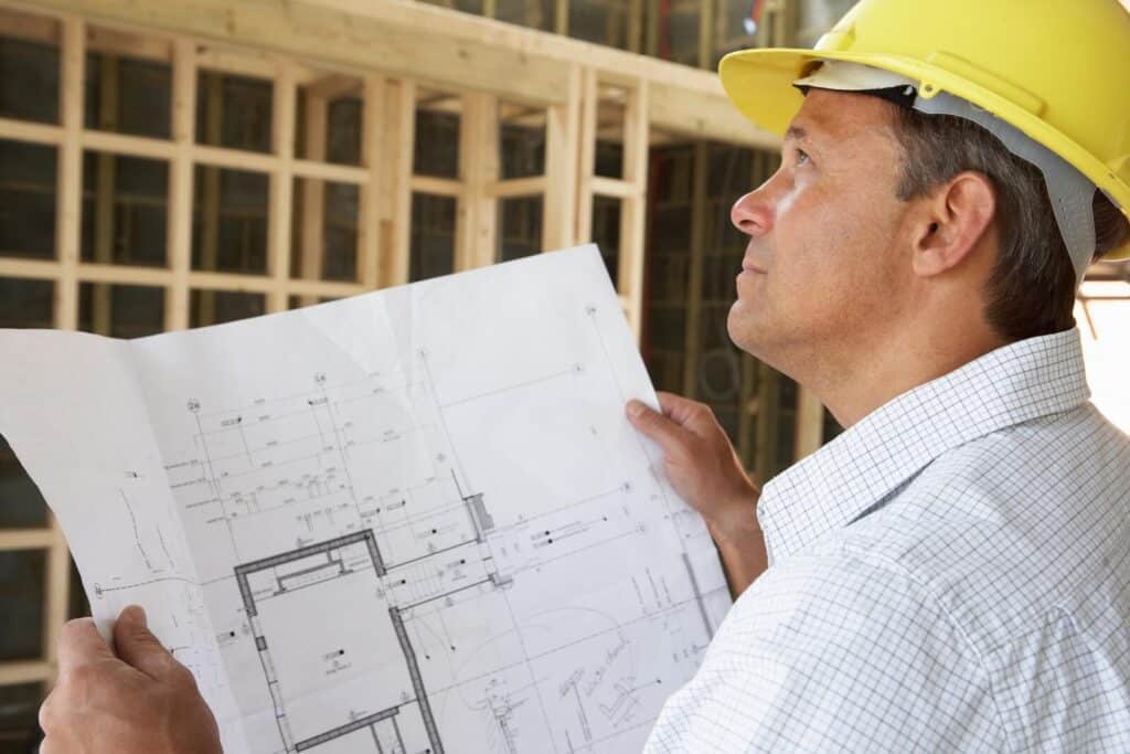 A home builder reviews plans