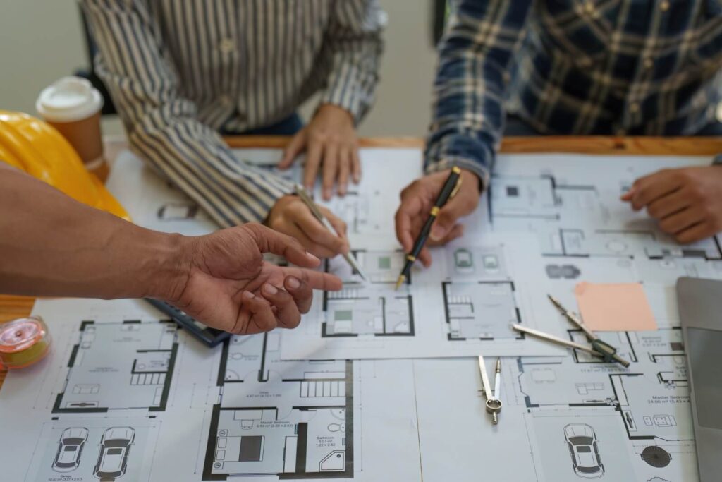 home builders go over floor plans