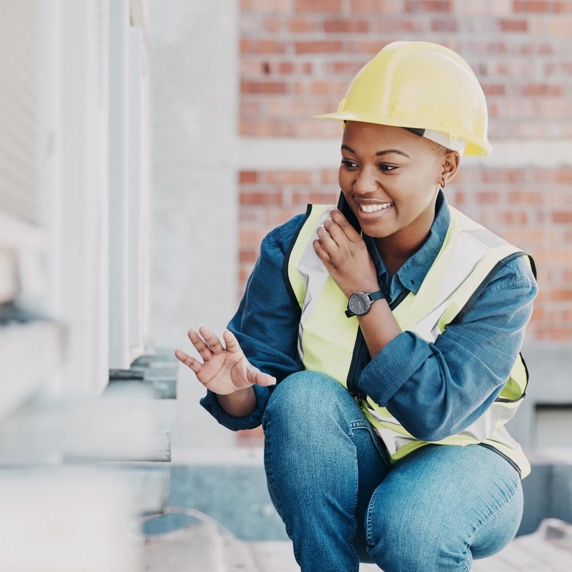 An HVAC tech takes a call from a lead while on the job.