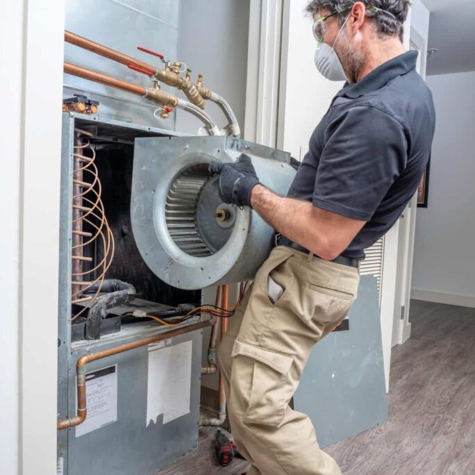 HVAC technician removes equipment