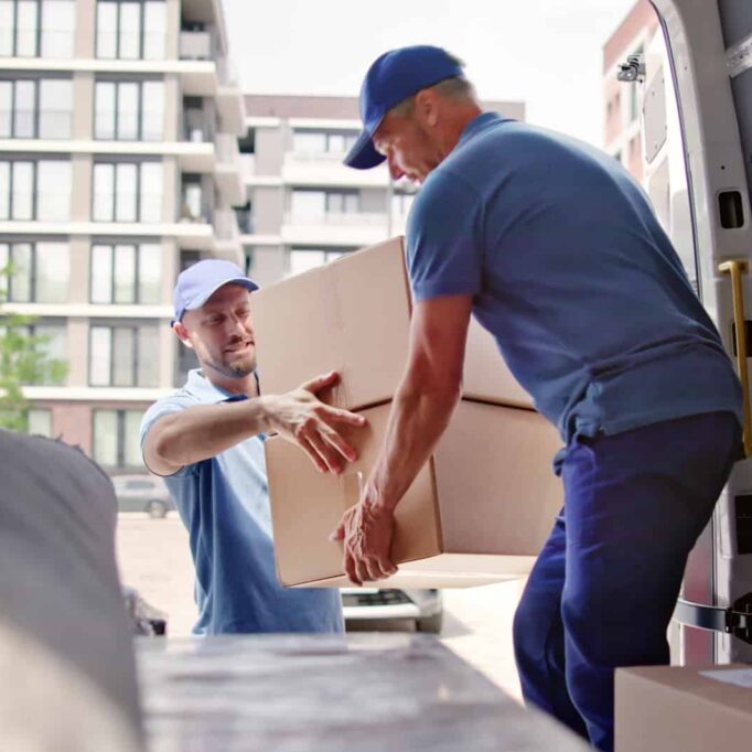 movers unload moving van