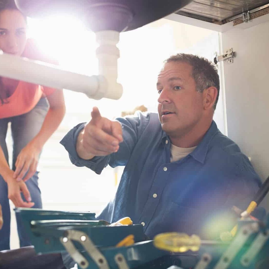 plumber explains issue to client