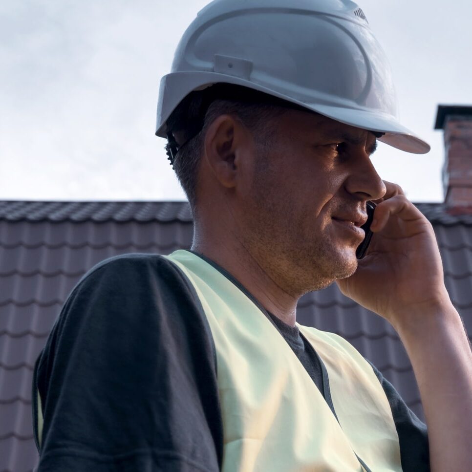 Roofer takes a phone call